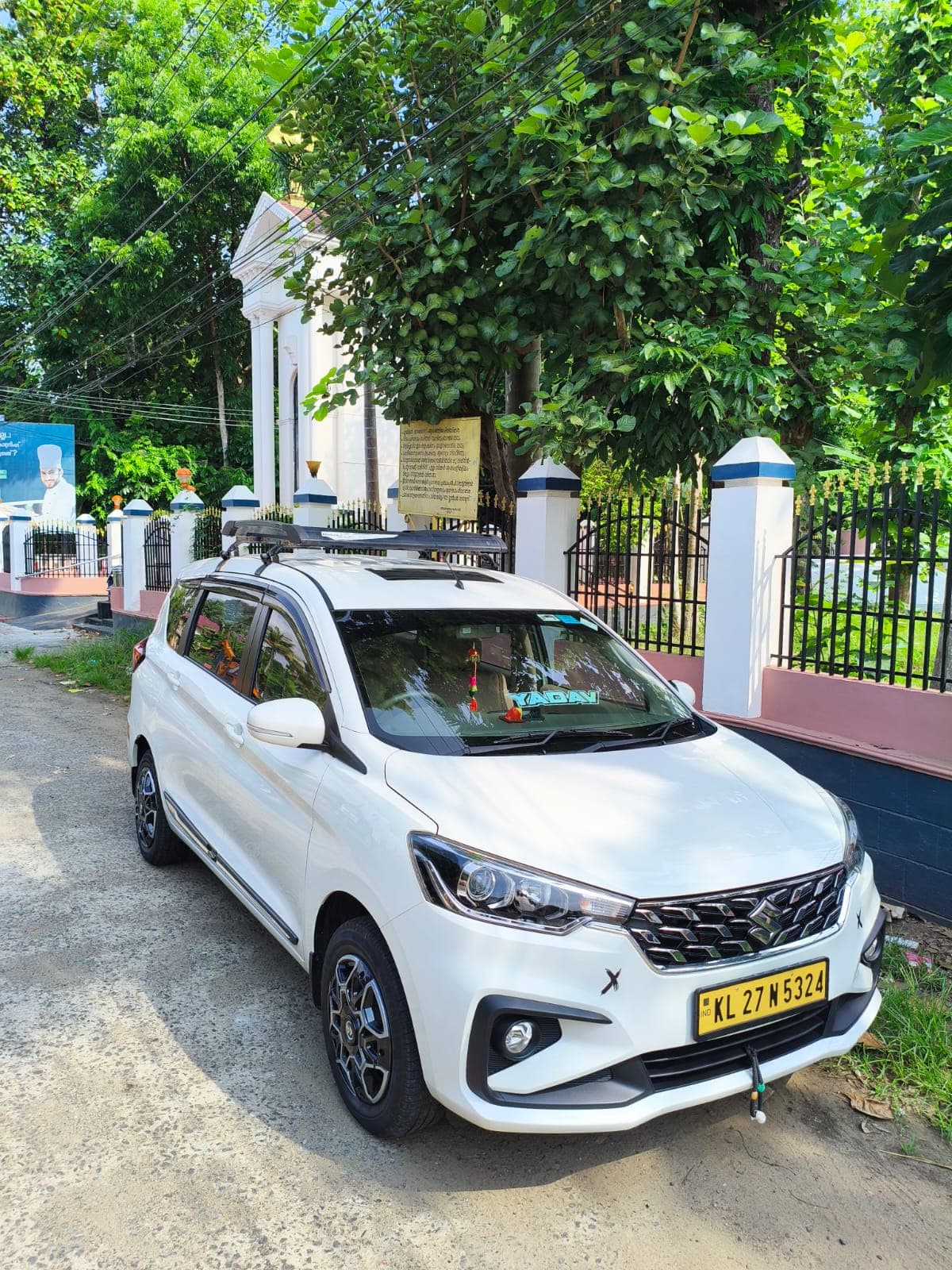 Maruti Suzuki Ertiga — front three-quarter view showing grille and headlights up close