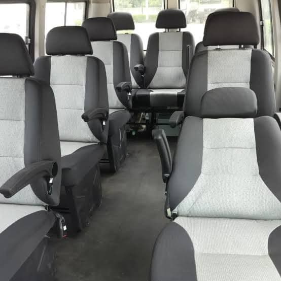 Spacious multi-row passenger cabin with cushioned seats