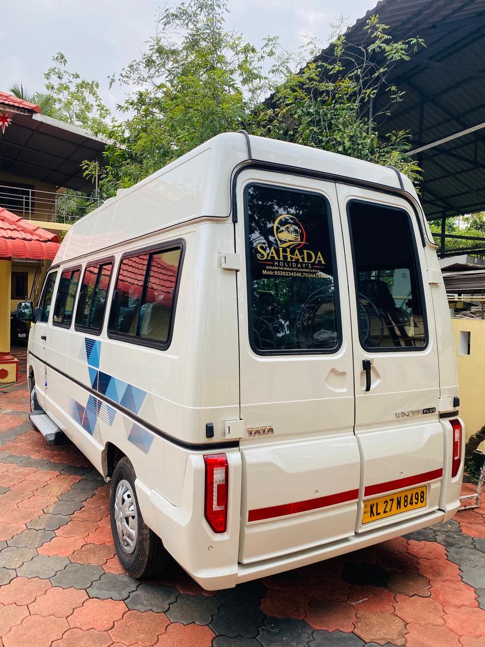 Tata Winger — rear view with Sahada Holiday's branding