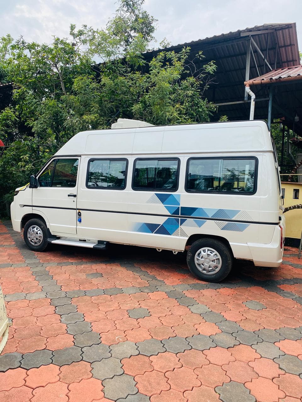 Tata Winger — full side profile showing high-roof body